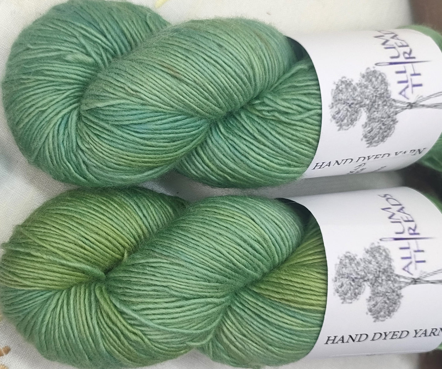 19345 Green marbled four ply merino singles high twist yarn