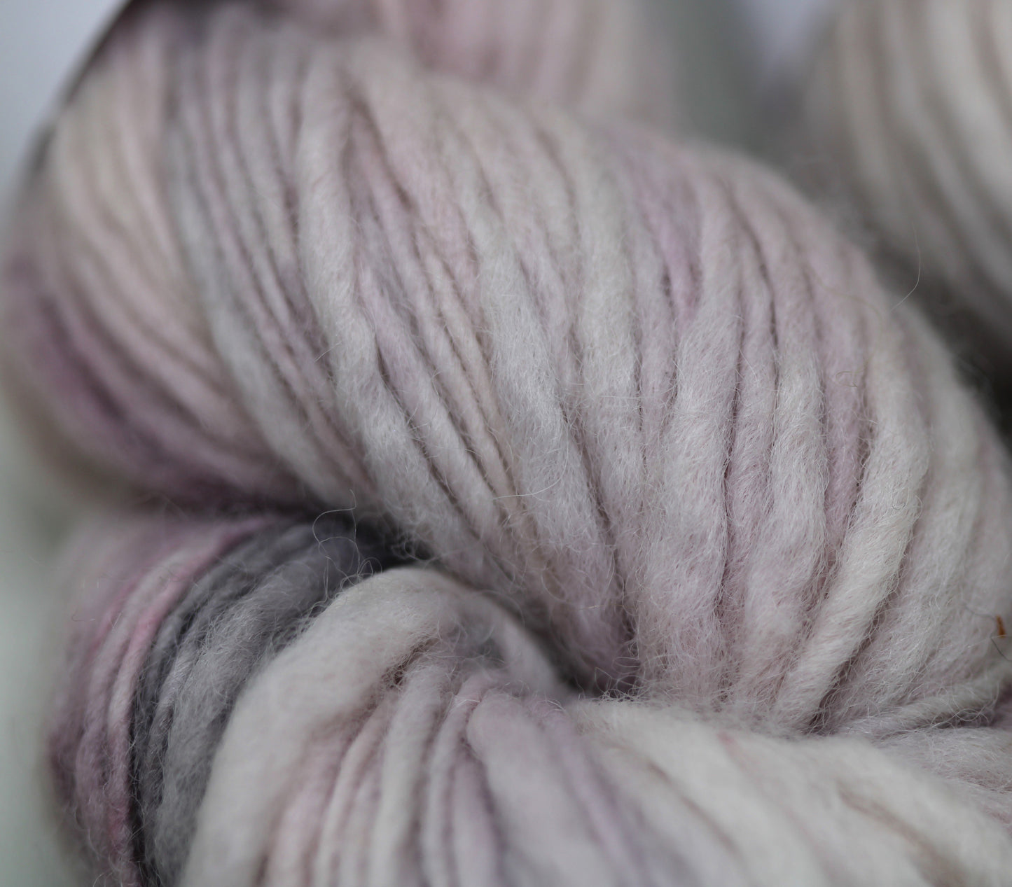 Pink and purple chunky slubby wool singles yarn
